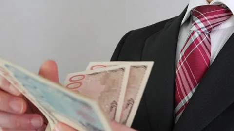 Businessman counting banknotes Stock Footage 325692727