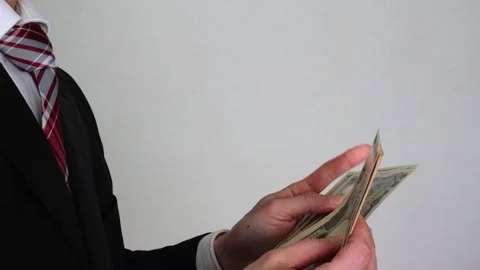 Businessman counting banknotes Stock Footage 325693444