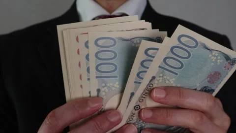 Businessman counting banknotes Stock Footage 325693447