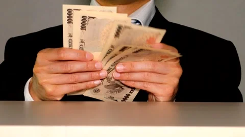 A businessman counting banknotes Stock Footage 335042514