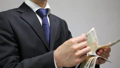 A businessman counting banknotes Stock Footage 335733074