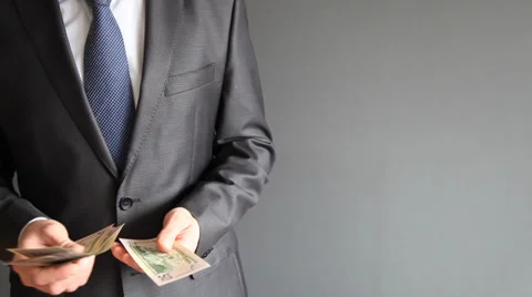 Businessman counting dollar banknotes Stock Footage 31738543