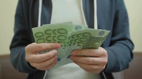 Businessman counting euro banknotes. A man counts euro bills, close-up of h.. Stock Footage 265881553