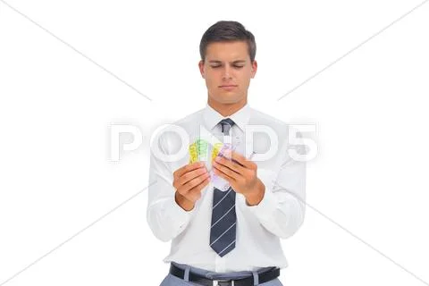 Businessman counting money Stock-Fotos