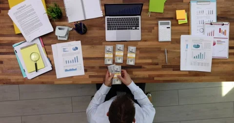 Businessman counting money stacks of dollars at table in office top view 4k Stock Footage 239619853