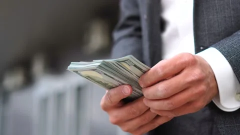 Businessman counting usd bills cash dollars money banknotes outdoor Stock Footage