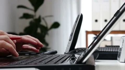 Businessman counts on the calculator in an office - 4k Video stock 71338053