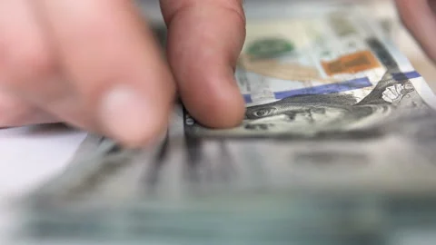 Businessman counts dollars Stock Footage 103667431