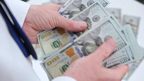 Businessman counts a stack of cash hundred-dollar bills of the USA. close-up. Stock Footage 197312600