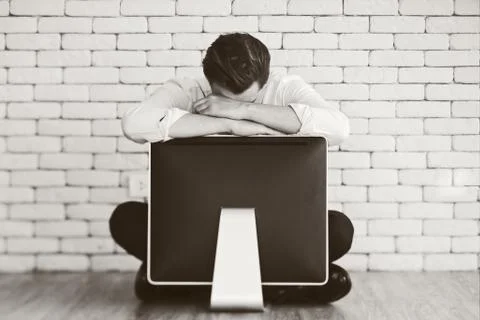 Businessman crying on old computer Stock Photos