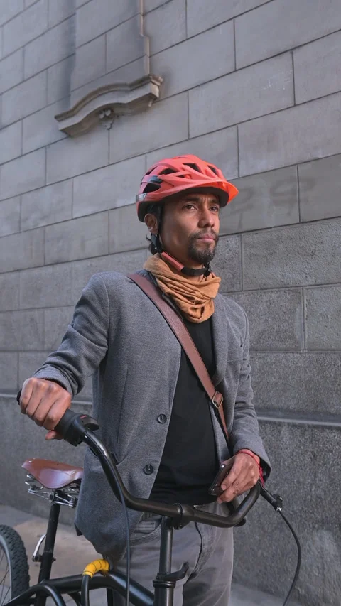 Businessman cyclist stopped using his cell phone. Stock Footage 290154859