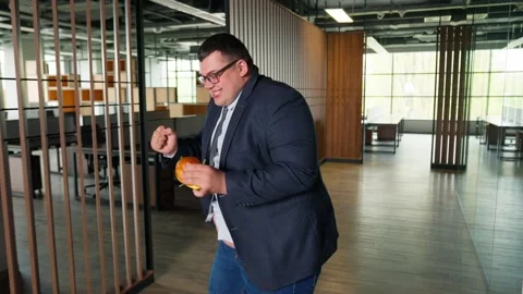 Businessman Dancing With Burger Stock Footage 273562975