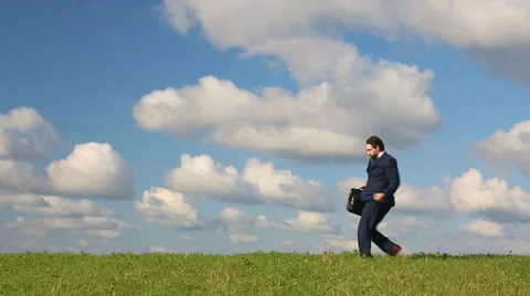 Businessman dancing on the field Stock Footage 67690745