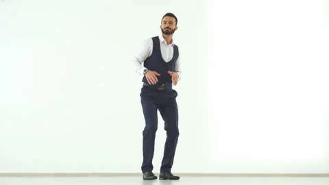 The businessman dancing on the white wall background Video stock 100751525