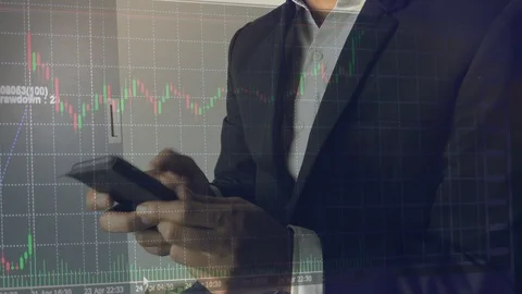 Businessman with data analysis graph of stock market investment Stock Footage 106699848
