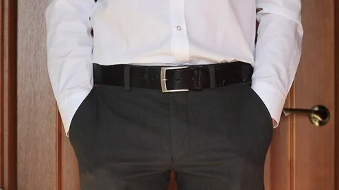 Businessman demonstrates his empty pockets 動画素材 70750090