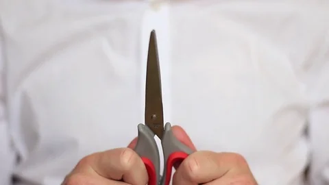 Businessman demonstrates scissors Stock Footage 70750218