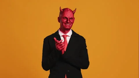 Businessman with devil horns clapping his hands Stock Footage 290102223