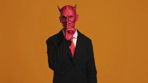Businessman with devil horns making silence gesture Stock Footage 287341203