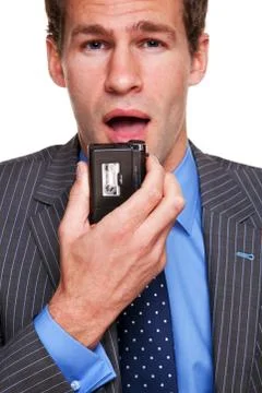 Businessman dictating notes Stock Photos
