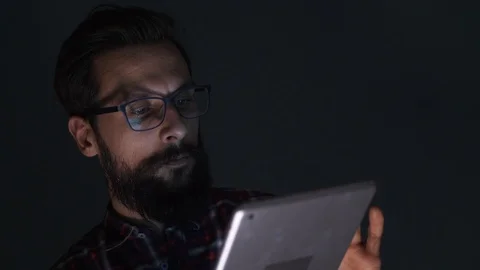 Businessman with digital tablet working late  Video stock 86898511