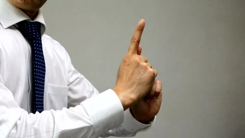 A businessman disappears while striking a ninja pose. Stock Footage 335734888