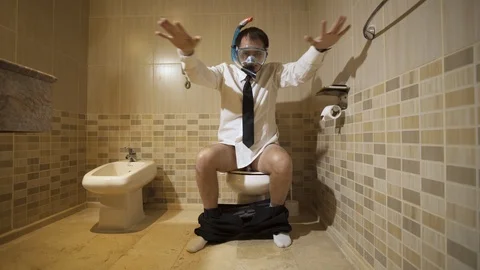 Businessman in diving mask in the restroom Stock Footage 101854741