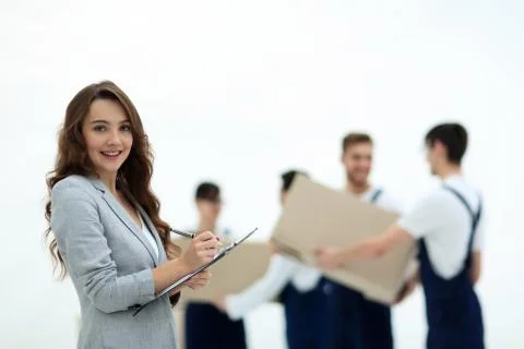 Businessman with documents, creating a stack of cardboard boxes. Stock Photos