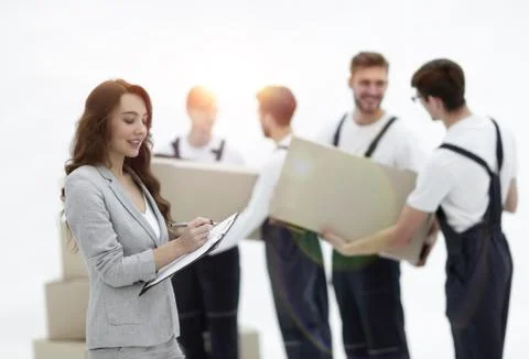 Businessman with documents, creating a stack of cardboard boxes. Stock Photos