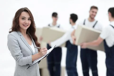 Businessman with documents, creating a stack of cardboard boxes. Stock Photos