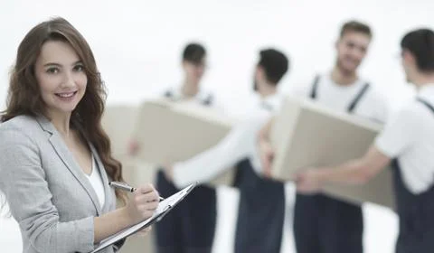 Businessman with documents, creating a stack of cardboard boxes. Stock Photos