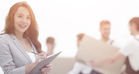 Businessman with documents, creating a stack of cardboard boxes. Stock Photos