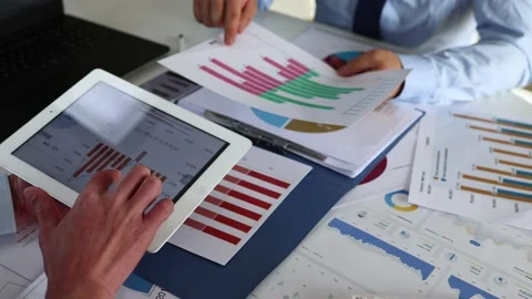 Businessman doing data analysis with tablet Stock Footage 228708280
