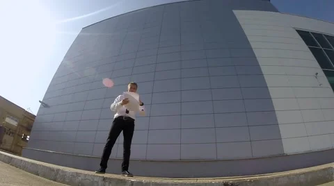 Businessman Doing flips and tricks. Jumping near wall. Stock Footage 67343516