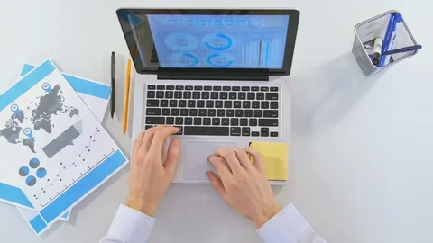 Businessman doing a lot of things while sitting at the computer Video stock 81488070