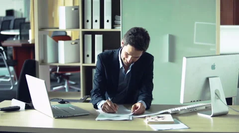 Businessman doing paperwork Stock Footage 63296856