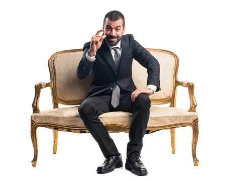 Businessman doing tiny sign Stock Photos