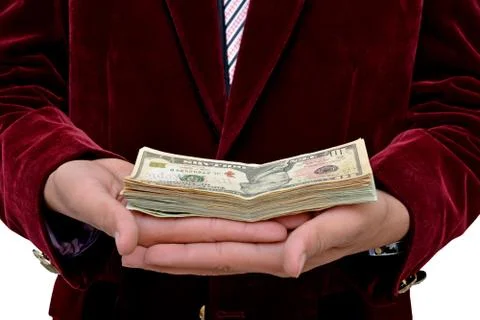 Businessman with dollars currency stack on hands Stock-Fotos
