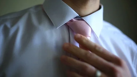 Businessman dons a tie Stock Footage 81322262