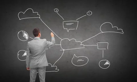 Businessman drawing cloud computing scheme Stock Photos