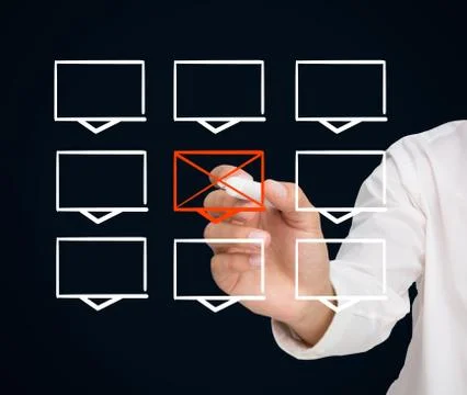 Businessman drawing a cross through a rectangle in a grid Stock Photos