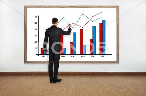 Businessman drawing graph Stock Photos