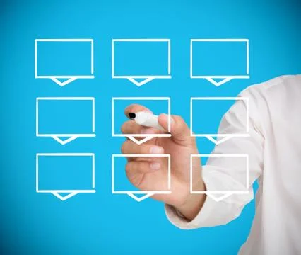Businessman drawing a grid of white rectangles Stock Photos