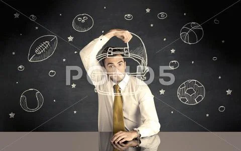 Businessman drawing helmet and sport balls Stock Photos