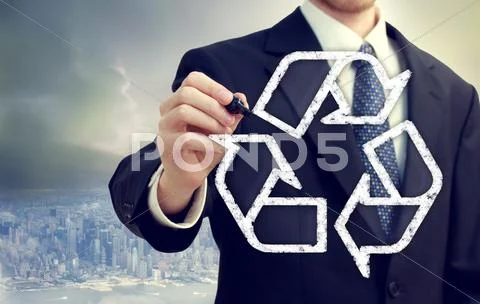 Businessman drawing recycle sign Stock Photos