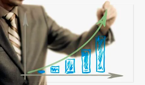Businessman drawing rising graph, development and growth concept Stock Photos