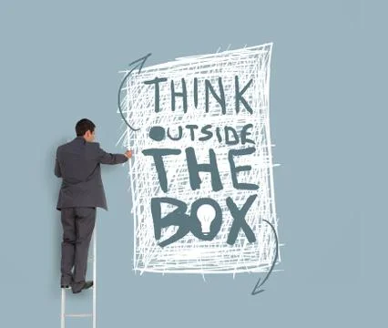 Businessman drawing think outside the box message Stock Photos