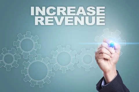 Businessman drawing on virtual screen. increase revenue concept. Fotos Stock