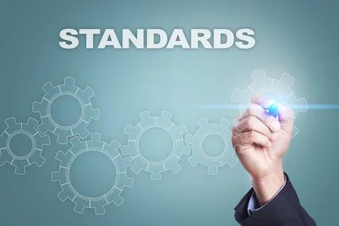 Businessman drawing on virtual screen. standards concept. Stock Photos