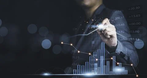 Businessman drawing virtual technical graph and chart for analysis stock mark Stock Photos